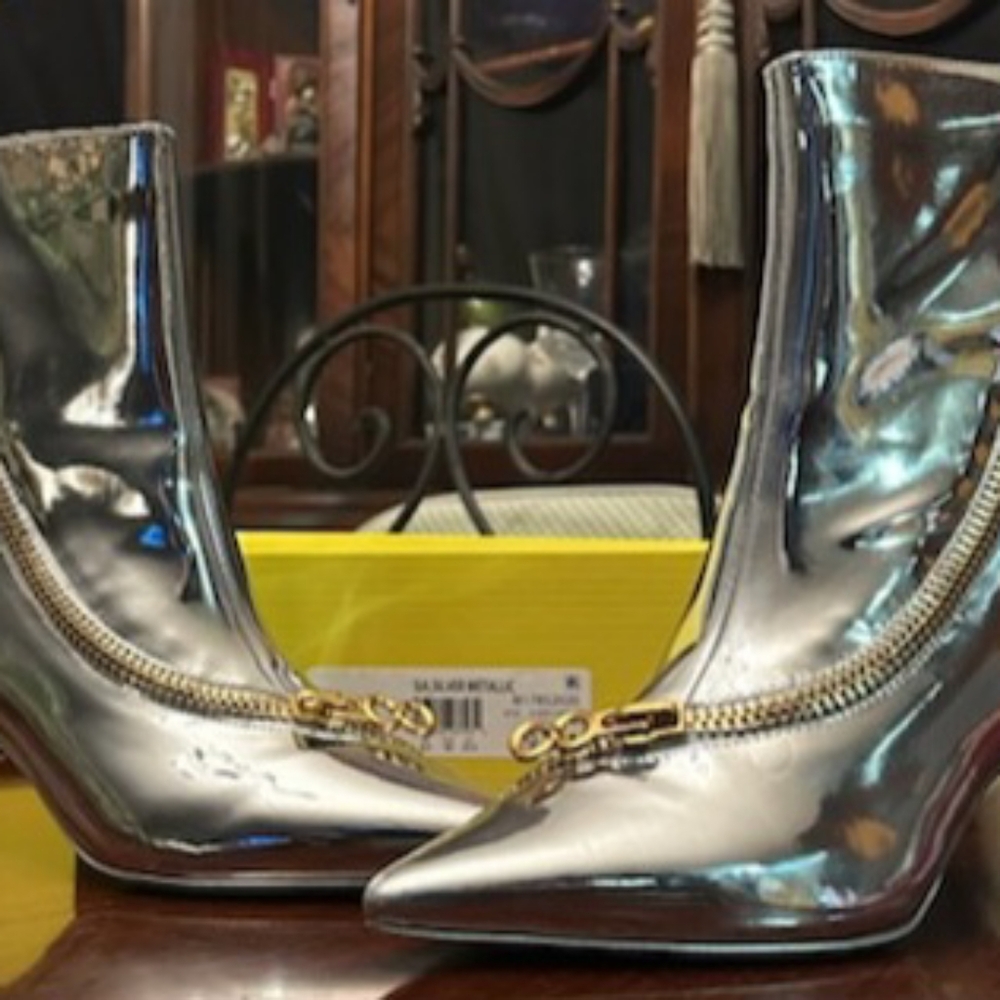 Brand new Silver booties with gold frontal zipper